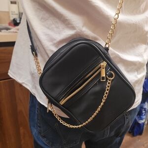 Elegant Black Crossbody Bag with Gold Accents